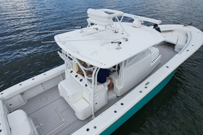  Yacht Photos Pics 2009 Yellowfin 42 Offshore boat on water, featuring spacious deck and modern design.