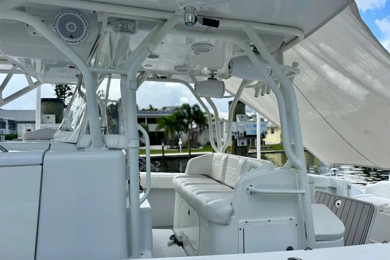 Yacht Photos Pics 2009 Yellowfin 42 Offshore boat interior with white seating and canopy.