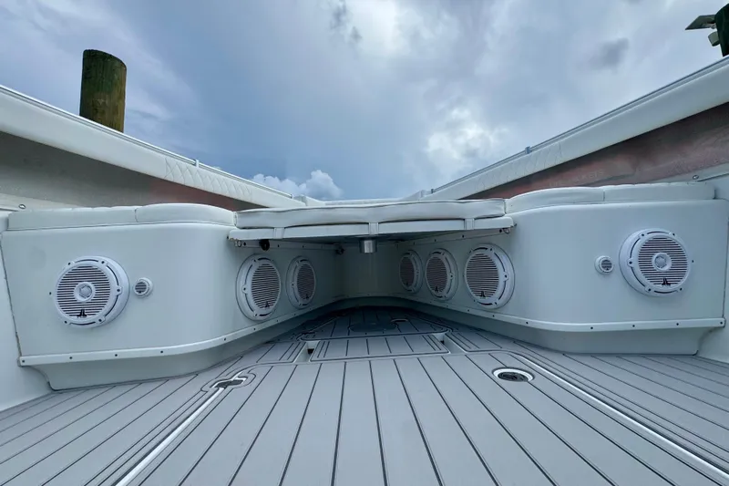  Yacht Photos Pics 2009 Yellowfin 42 Offshore boat interior with speakers and cushioned seating.