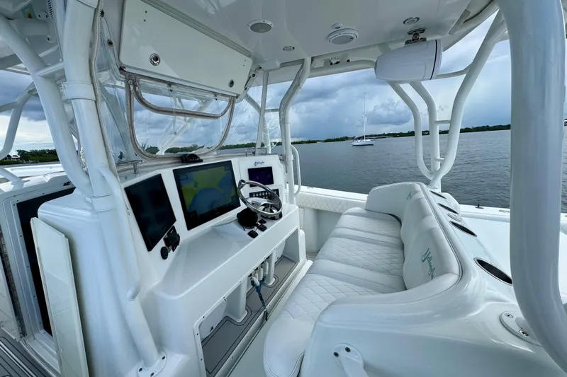  Yacht Photos Pics 2009 Yellowfin 42 Offshore boat interior with modern navigation equipment and plush seating.