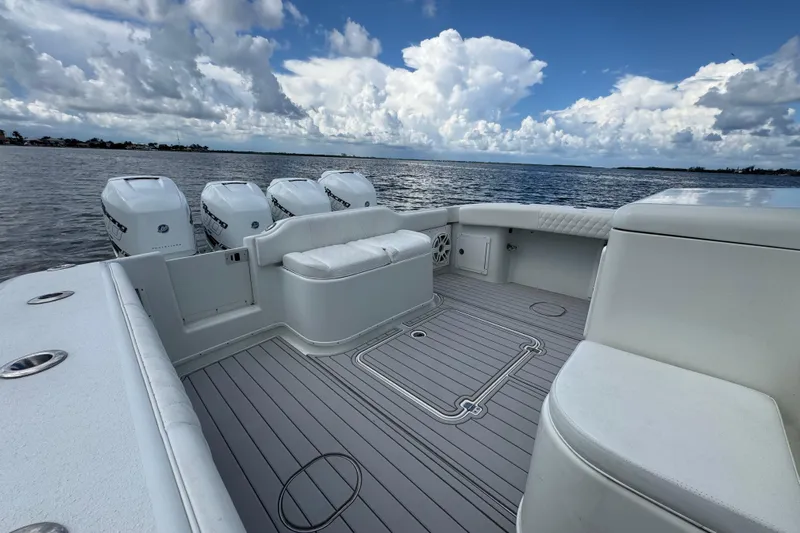  Yacht Photos Pics 2009 Yellowfin 42 Offshore boat with spacious deck and multiple outboard engines.