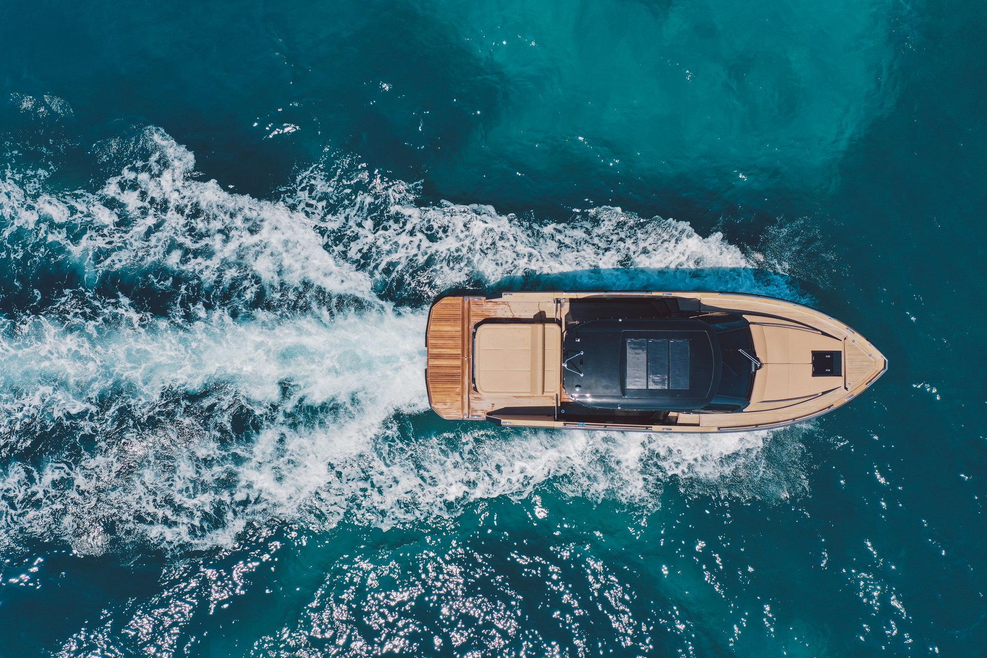 Aerial view of 2025 Focus Forza 37 yacht cruising in clear blue waters.