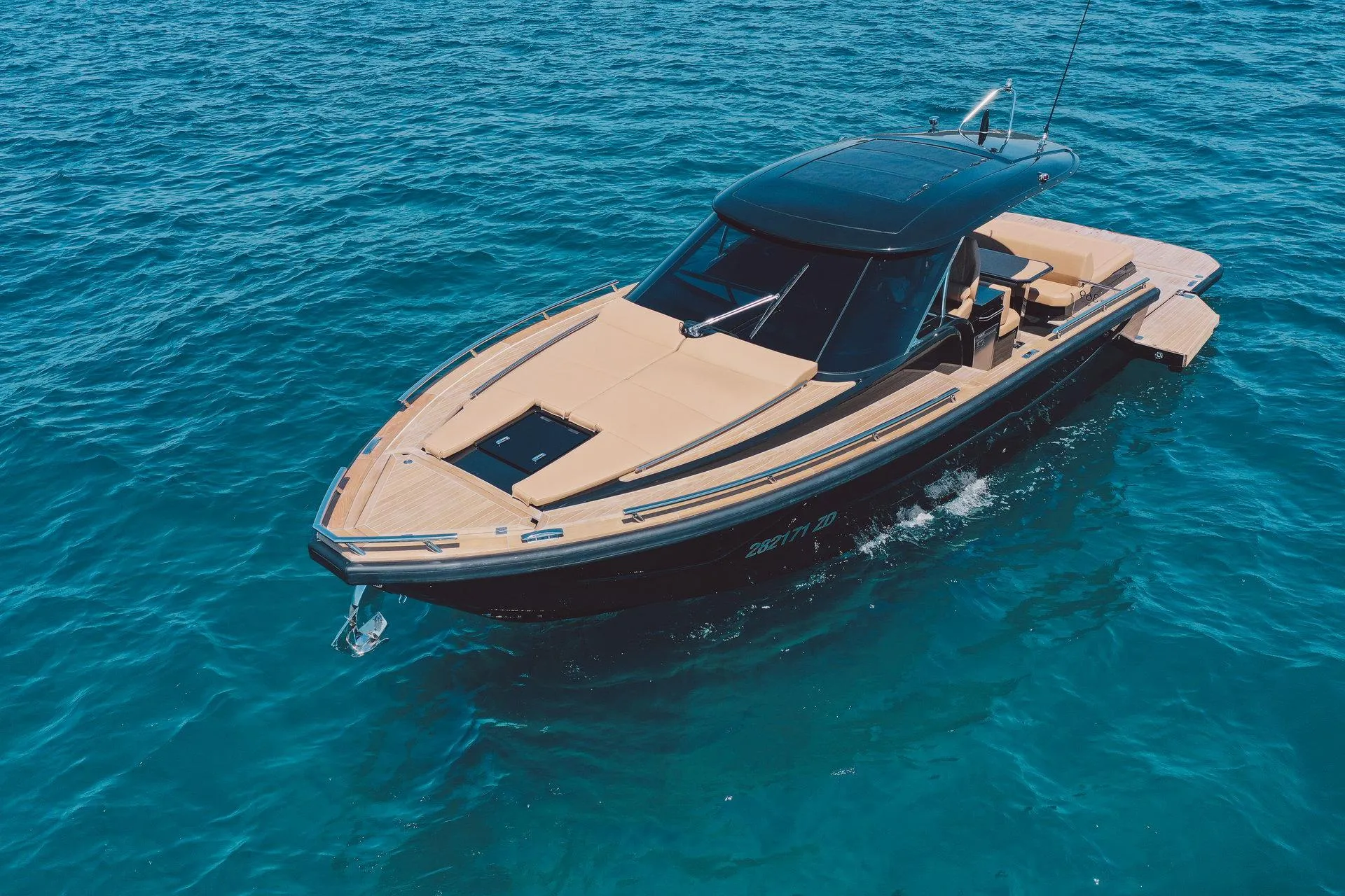 2025 Focus Forza 37 luxury boat cruising on clear blue water.