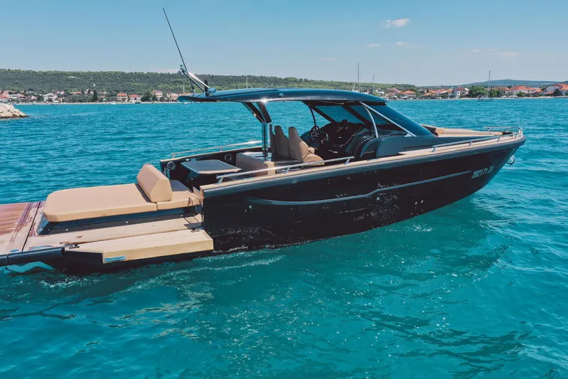  Yacht Photos Pics Luxury 2025 Focus Forza 37 boat cruising on clear blue water.