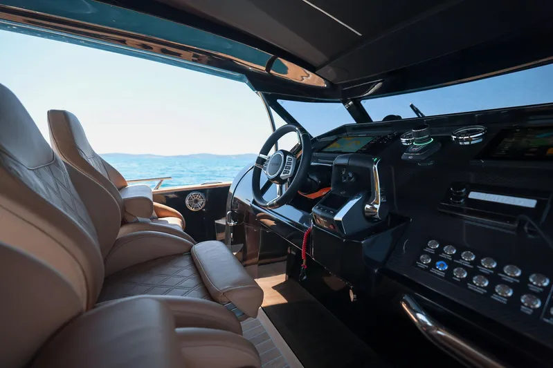  Yacht Photos Pics Interior of 2025 Focus Forza 37 yacht, featuring luxurious seating and modern dashboard controls.