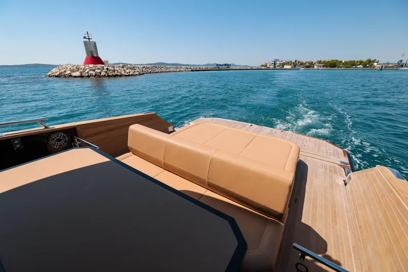  Yacht Photos Pics 2025 Focus Forza 37 yacht cruising near a lighthouse on a sunny day.