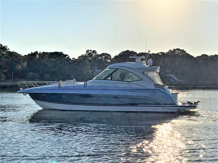  Yacht Photos Pics 2018 Formula 45 Yacht on calm water at sunset.
