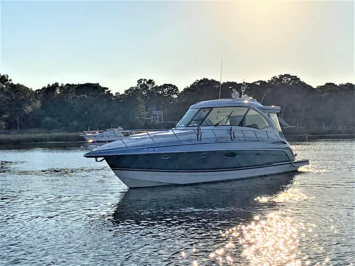  Yacht Photos Pics 2018 Formula 45 Yacht on calm water at sunset.