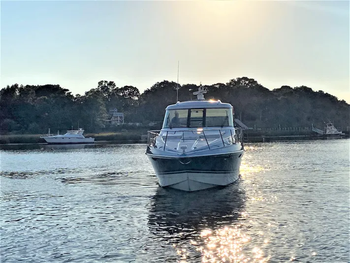  Yacht Photos Pics 2018 Formula 45 Yacht on calm water at sunset.