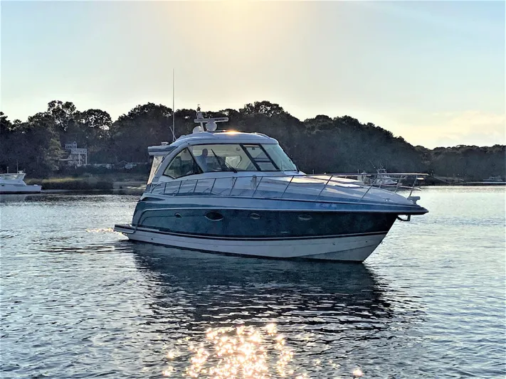  Yacht Photos Pics 2018 Formula 45 Yacht on calm water at sunset.