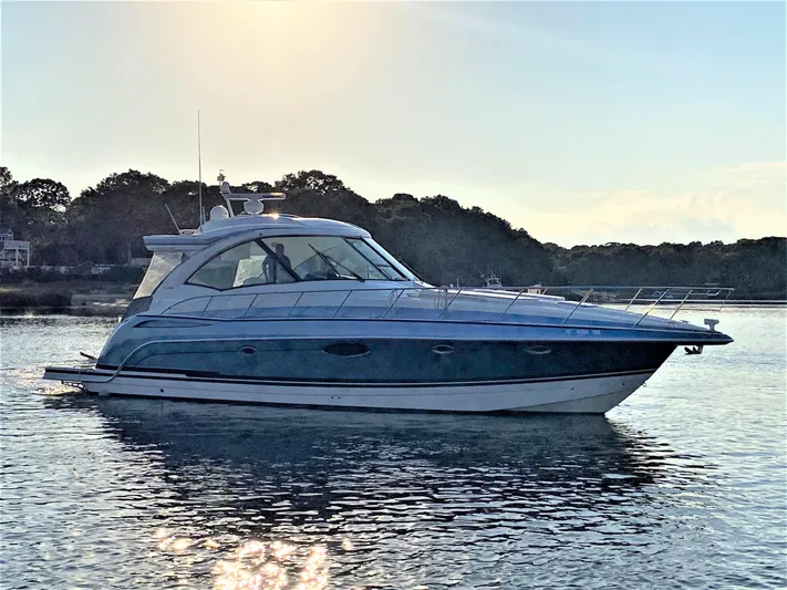  Yacht Photos Pics 2018 Formula 45 Yacht on calm water at sunset.