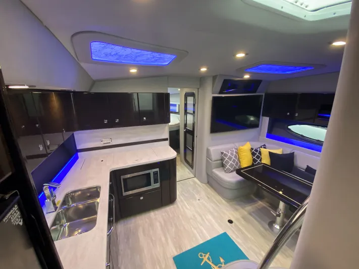  Yacht Photos Pics Interior of a 2018 Formula 45 Yacht with modern kitchen and seating area.