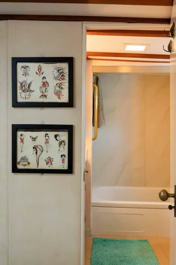 Seafari Yacht Photos Pics Interior of 1975 Burger Raised Pilothouse CPMY with framed art and bathroom view.