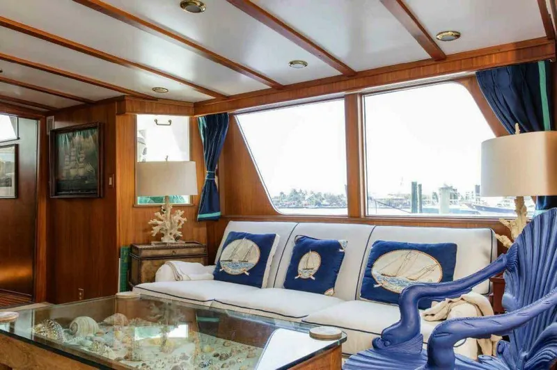 Seafari Yacht Photos Pics Luxurious 1975 Burger Raised Pilothouse CPMY yacht interior with nautical decor and large windows.