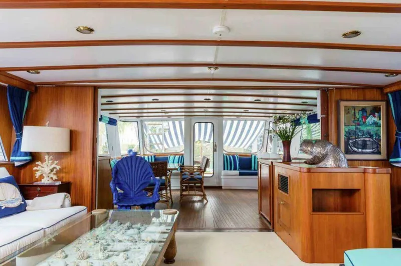 Seafari Yacht Photos Pics Luxurious interior of a 1975 Burger Raised Pilothouse CPMY yacht with elegant wood finishes.