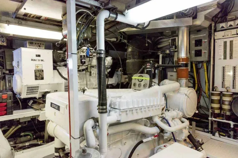 Seafari Yacht Photos Pics Engine room of a 1975 Burger Raised Pilothouse CPMY yacht, showcasing machinery and equipment.