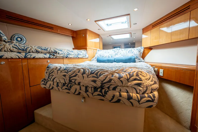 Strictly Business Yacht Photos Pics Luxurious cabin interior of 2004 Hatteras 65 Enclosed Bridge yacht with elegant bedding.