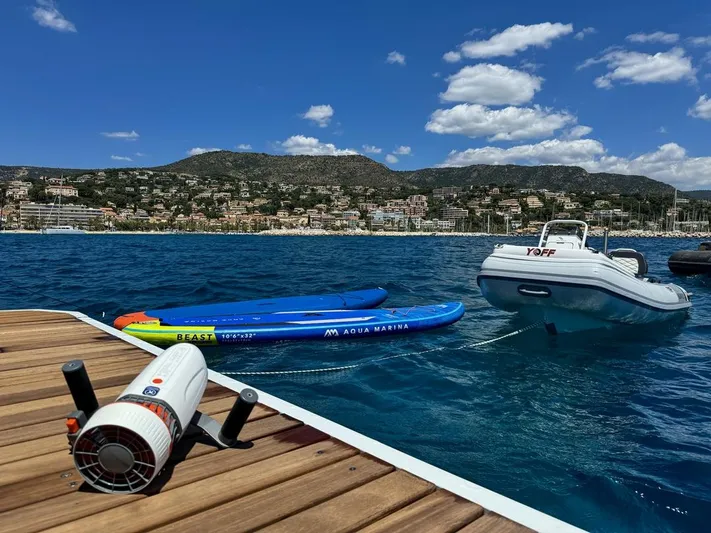 Yoff Yacht Photos Pics Dock with paddleboards and inflatable boat on a sunny day, Lagoon 46, 2023.
