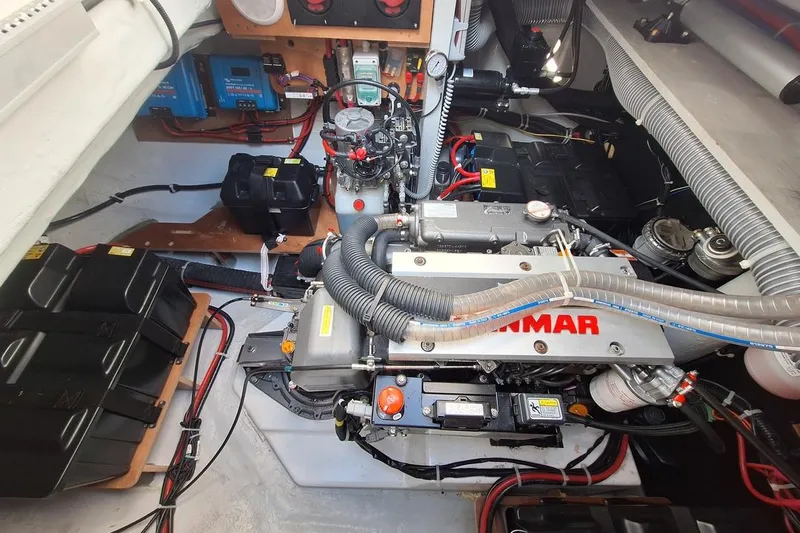 Yoff Yacht Photos Pics Engine room of a 2023 Lagoon 46 yacht, featuring a Yanmar engine and electrical components.