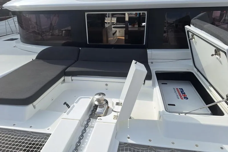 Yoff Yacht Photos Pics 2023 Lagoon 46 yacht deck with seating and storage compartments.