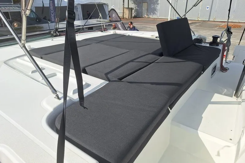 Yoff Yacht Photos Pics 2023 Lagoon 46 catamaran deck with cushioned seating and modern design.