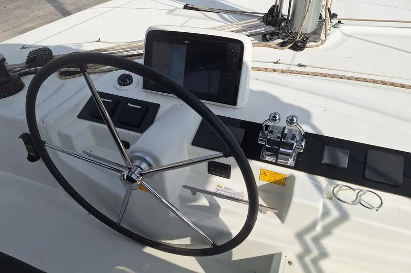 Yoff Yacht Photos Pics Steering wheel and controls of 2023 Lagoon 46 catamaran yacht.