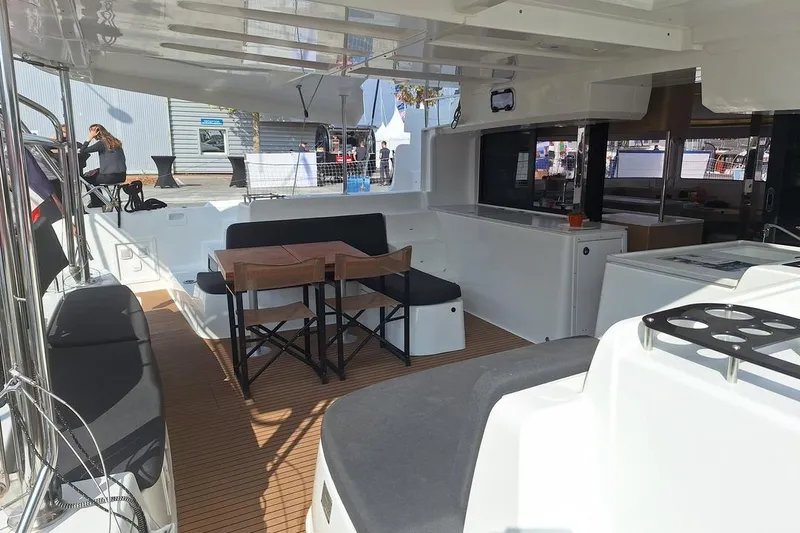 Yoff Yacht Photos Pics Spacious deck of 2023 Lagoon 46 catamaran with seating and dining area.