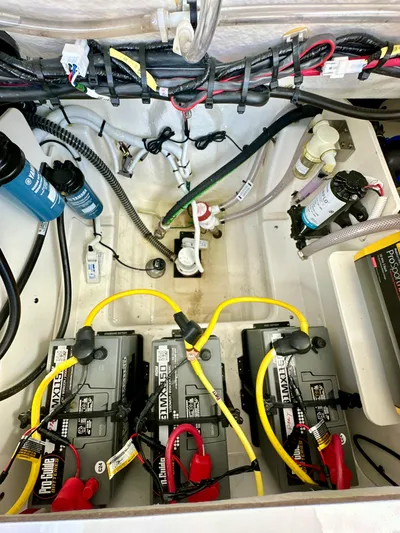  Yacht Photos Pics 2024 Robalo R250 Center Console boat battery compartment with wiring and filters.