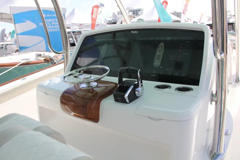  Yacht Photos Pics 2025 Mag Bay 43 boat helm with modern controls and touchscreen display.