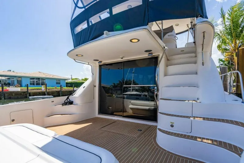 Captain Yacht Photos Pics 1999 Sea Ray 560 Sedan Bridge yacht with spacious deck and elegant design.