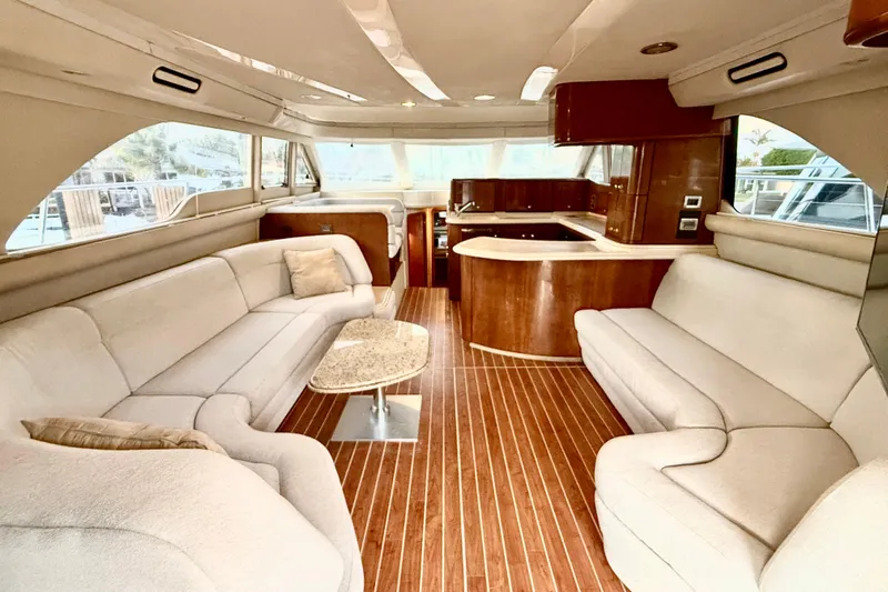  Yacht Photos Pics Luxurious interior of 1999 Sea Ray 560 Sedan Bridge yacht with elegant seating and wood finishes.