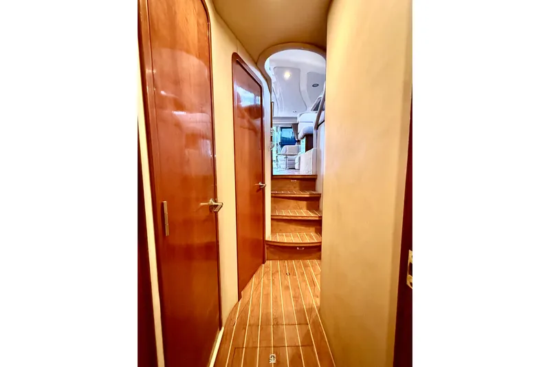  Yacht Photos Pics Hallway inside 1999 Sea Ray 560 Sedan Bridge yacht with wooden doors and steps.