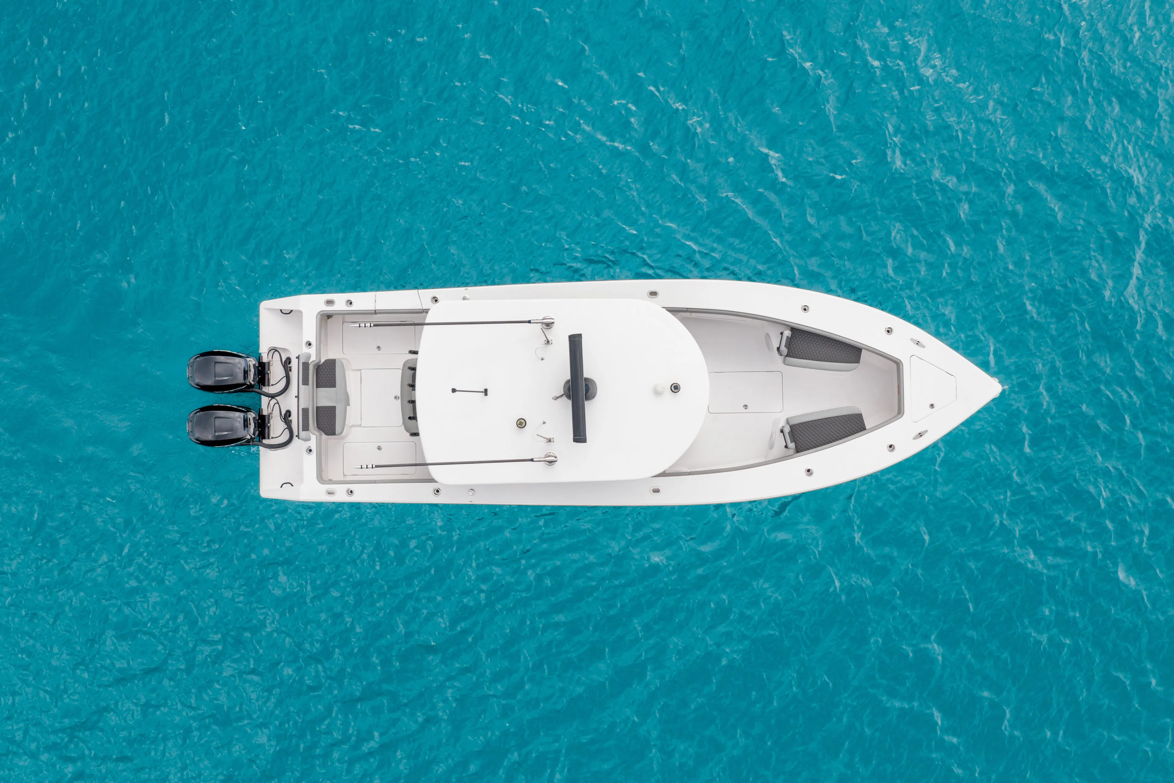  Yacht Photos Pics Aerial view of 2022 Jupiter 32 boat on clear blue water.