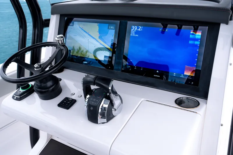  Yacht Photos Pics 2022 Jupiter 32 boat dashboard with dual Garmin displays and steering wheel.