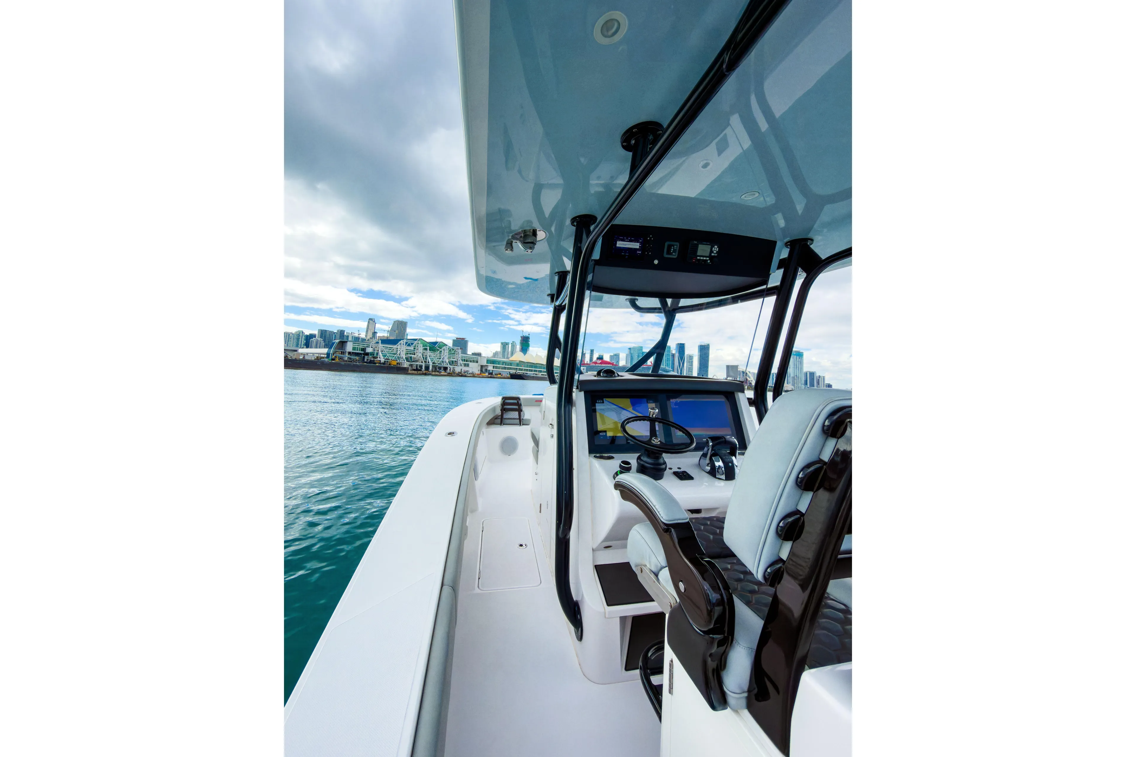  Yacht Photos Pics 2022 Jupiter 32 boat interior with city skyline in background.