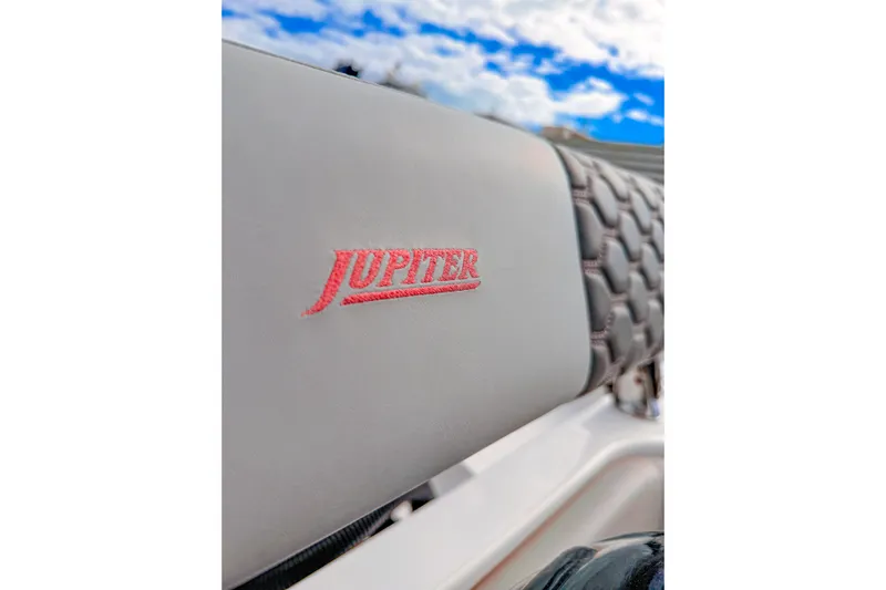  Yacht Photos Pics Jupiter 32 boat seat with logo, 2022 model, under a blue sky.