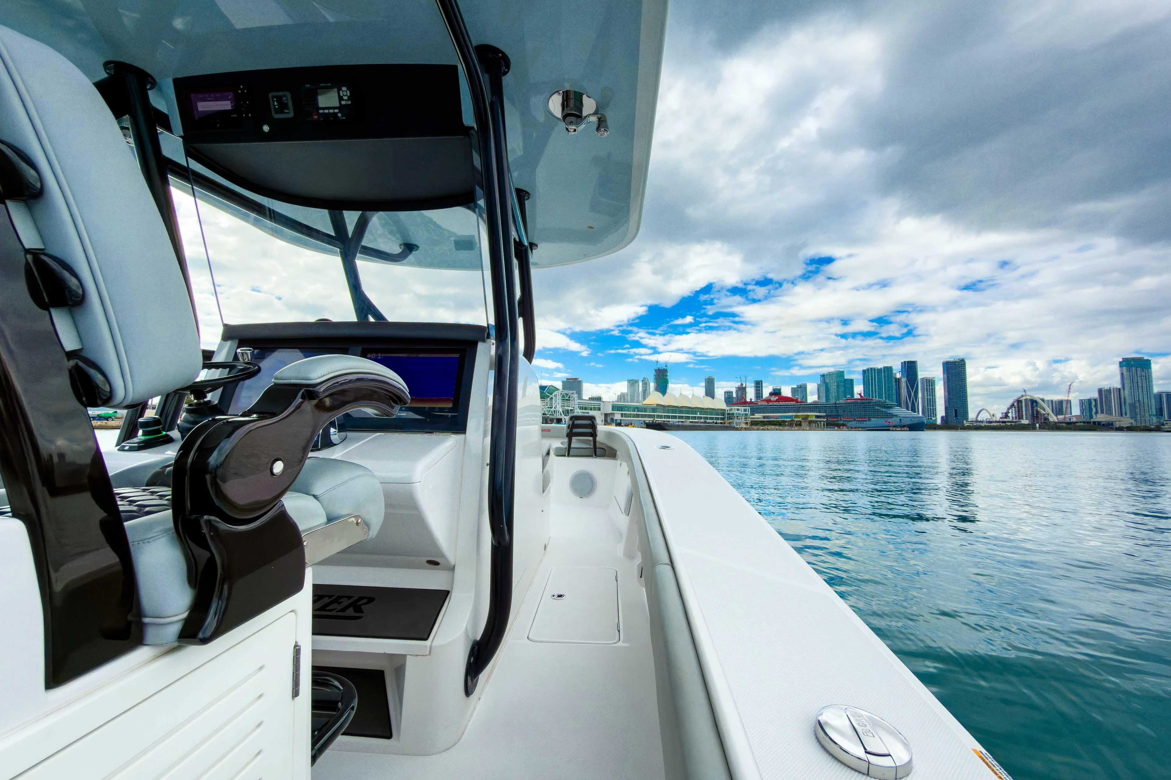  Yacht Photos Pics 2022 Jupiter 32 boat interior with city skyline and waterfront view.