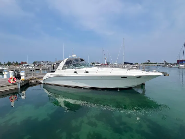  Yacht Photos Pics 1997 Sea Ray 400 Sundancer yacht docked in a marina under clear skies.