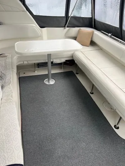  Yacht Photos Pics Interior of 1997 Sea Ray 400 Sundancer with seating and table.