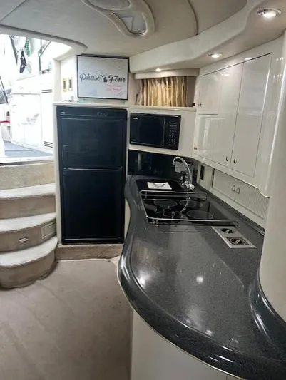  Yacht Photos Pics Interior of 1997 Sea Ray 400 Sundancer yacht with modern kitchen amenities.