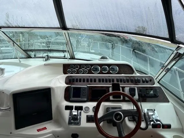  Yacht Photos Pics Cockpit view of a 1997 Sea Ray 400 Sundancer with steering wheel and control panel.