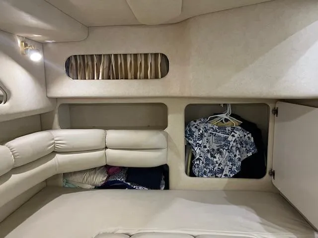  Yacht Photos Pics Interior of 1997 Sea Ray 400 Sundancer with seating and storage compartments.