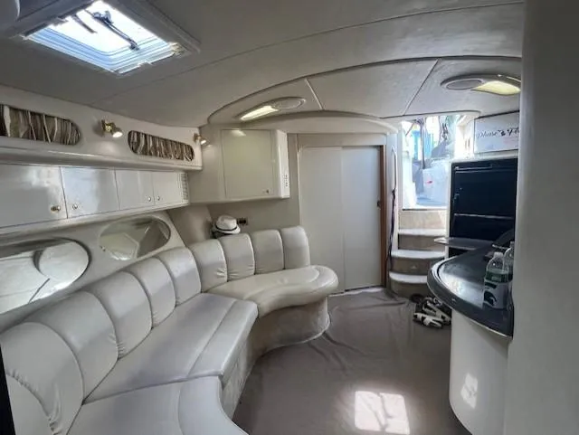  Yacht Photos Pics Interior of 1997 Sea Ray 400 Sundancer yacht with white leather seating and modern amenities.