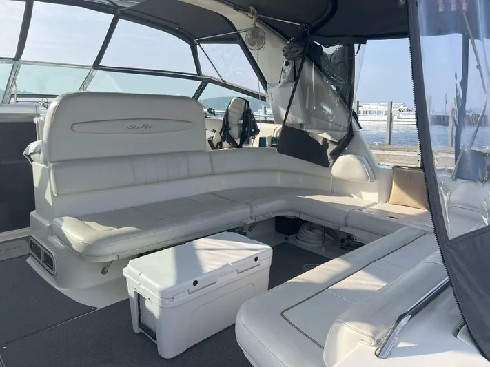  Yacht Photos Pics 1997 Sea Ray 400 Sundancer boat interior with white seating and a cooler.