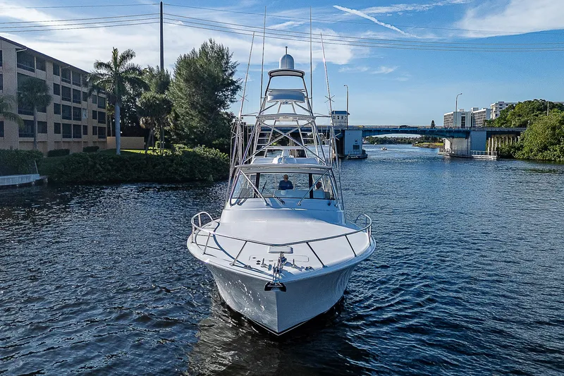  Yacht Photos Pics 2023 Viking 54 Open yacht cruising on a scenic waterway.