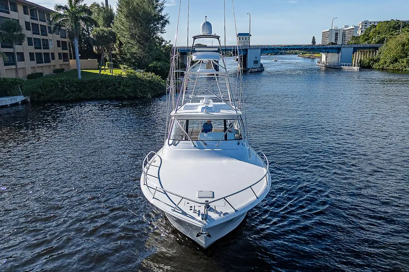  Yacht Photos Pics 2023 Viking 54 Open yacht cruising on a scenic waterway.