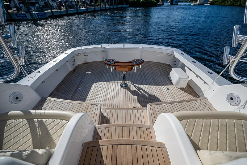  Yacht Photos Pics 2023 Viking 54 Open yacht deck with luxurious seating and ocean view.