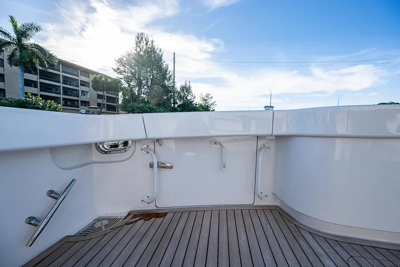  Yacht Photos Pics 2023 Viking 54 Open yacht deck with sleek design and wooden flooring.