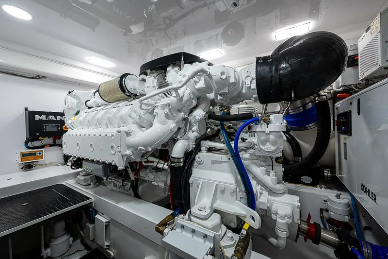 Yacht Photos Pics Engine room of 2023 Viking 54 Open yacht, featuring advanced machinery and components.