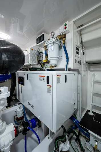  Yacht Photos Pics 2023 Viking 54 Open engine room with modern equipment and controls.